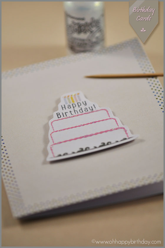 add glitter glue on birthday cake card